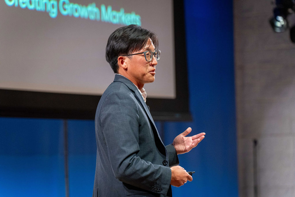 Founder presenting on creating growth markets