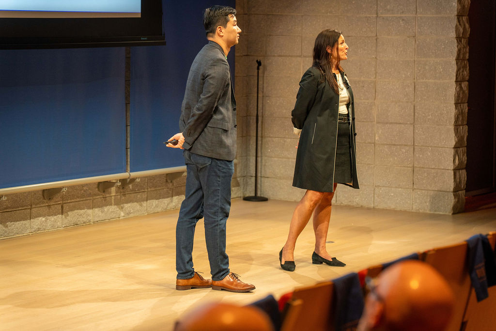 Two founders presenting together on stage